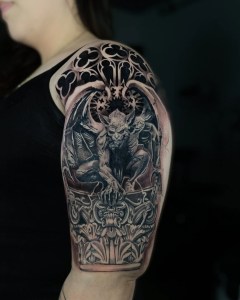 Realistic Black and Grey gargoyle Tattoo