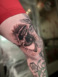 Luis at Monochrome Fresno, this design blends photorealism with ornamental flair. The intense eye gaze draws attention while intricate details surround it, highlighting Luis’s skills as a professional Fresno tattoo artist.